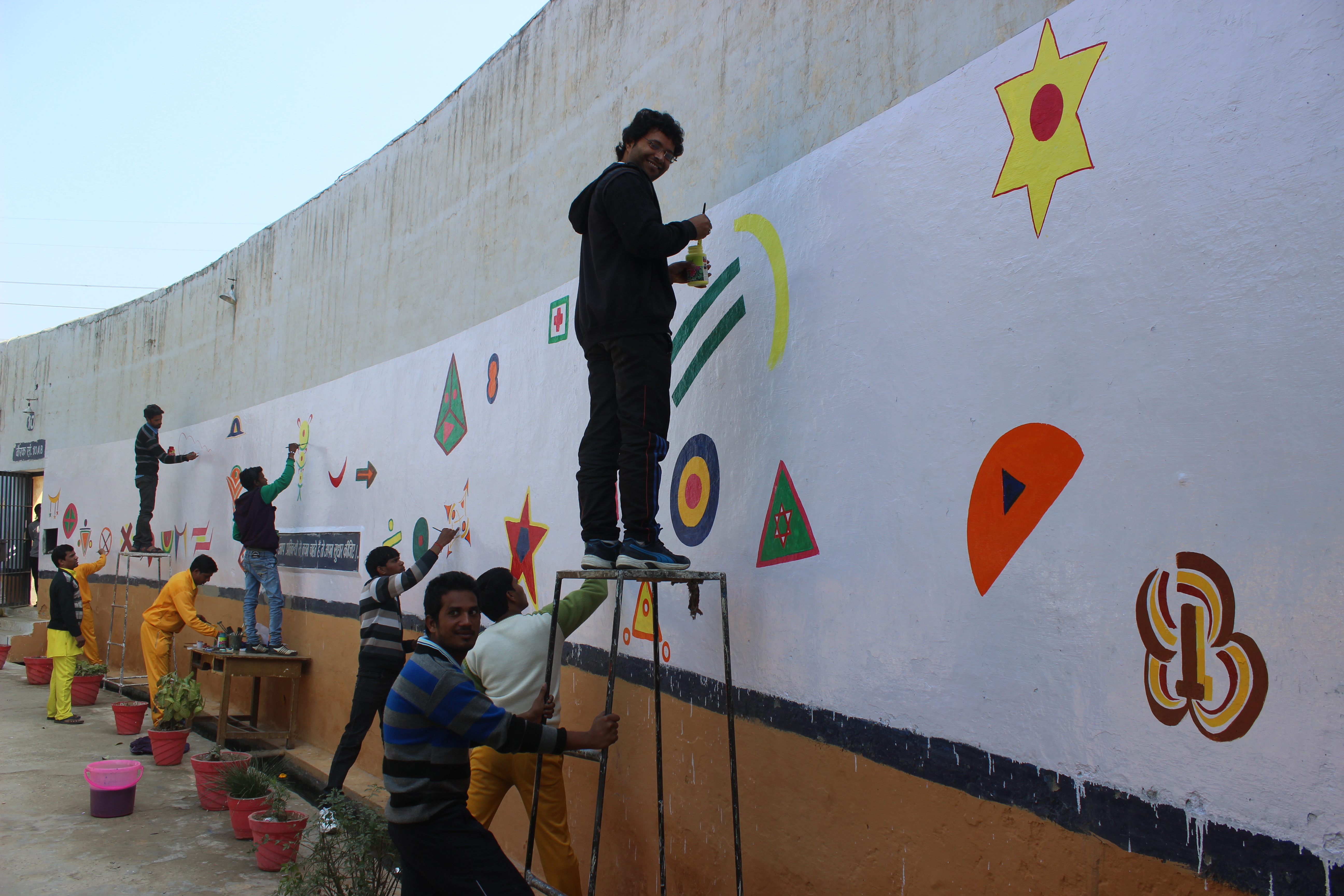 In the male ward we painted a 50 ft wall with the help of prisoners.