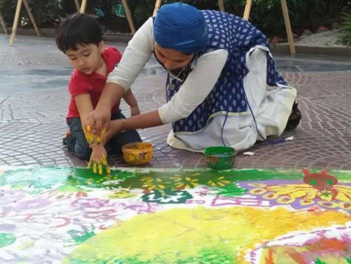 Meenakshi painting with a kid